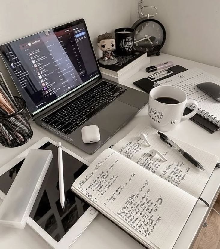 Clean workspace with laptop and documents for async work